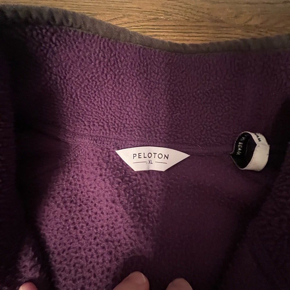 Warm Peloton fleece pullover with kangaroo pocket.